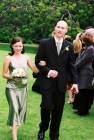 [Annie and Simon walk down the aisle]